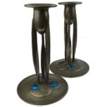 A pair of Archibald Knox design Liberty Tudric Art Nouveau pewter candlesticks of organic form