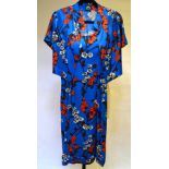 A royal blue satin dress with orange/white floral sprays and matching jacket,