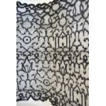 A large black lace mantilla (200 cm square),