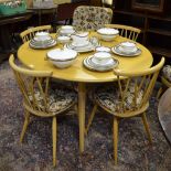 An Ercol light elm & beech dining set comprising a set of four 376 candlestick chairs and a drop