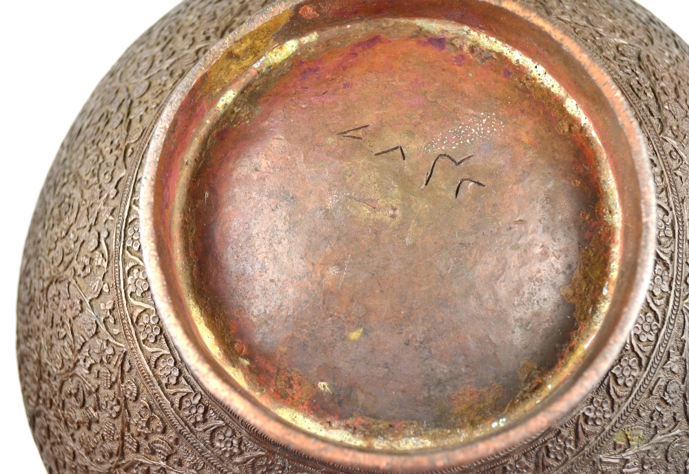 An antique Persian bowl cast overall with a foliate filigree pattern and having a crenulated - Image 2 of 2