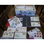 An extensive collection of postal first-day covers - loose and in albums (box)