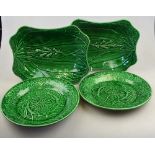 Four Victorian Wedgwood Green majolica plates - two rectangular dishes moulded with foxgloves 24 x