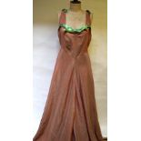A 1940's evening dress, salmon pink moire silk satin shot pale green with full skirt,