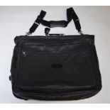 A black Scotchgrain leather Mulberry suit carrier with silvered fittings and canvas shoulder