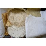 Two boxes of assorted table linen including tablecloths with crocheted edging, lace doilies,