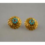 A pair of yellow metal cluster-style earrings set with ruby and turquoise within a leaf circlet,