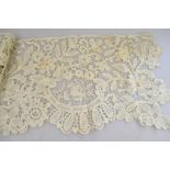 A collection of 19th century and other lace to include deep flounce of point de gaze,