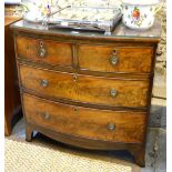 A George III mahogany bowfront chest of two short over three long graduated drawers over a shaped