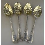 Four embossed and chased silver berry spoons,