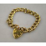9ct yellow gold flat curb bracelet fitted with padlock and safety chain,