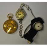 A lady's open faced 18k fob watch with engraved decoration and gilt dial, to/w a silver Buren