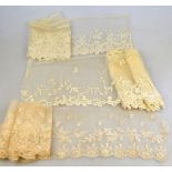 A collection of 19th century and other lace to include a Limerick lace flounce, pair of cuffs,