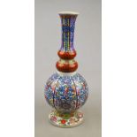 A Chinese gourd vase decorated in the 'Clobbered' style, 20th century, 28.5 cm Condition Report Good