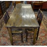A 19th century French provincial elm plank top refectory table having a frieze drawer to one side,
