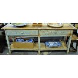 A Victorian pine pot board low dresser having a wide two plank cleated end top over a pair of
