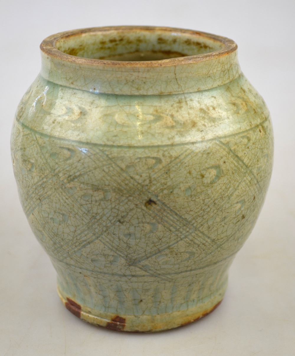 A Chinese celadon small jar incised with a geometric pattern Song/Yuan dynasty, circa 13th