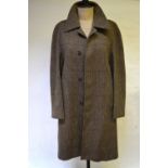 A 'Genuine Irish Tweed' gentleman's shower resistant coat, moss green/brown, retailed by Dunn & Co.