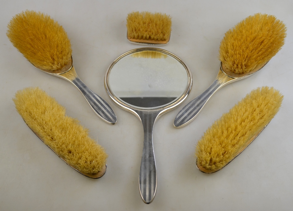 An engine-turned silver five-piece brush set, Birmingham 1922, to/w a small silver-backed brush, - Image 2 of 3