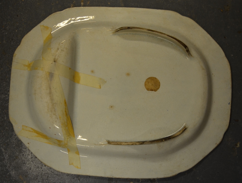 A 19th century blue and white meat plate with gravy well transfer decorated with an Asian/Oriental - Image 2 of 4