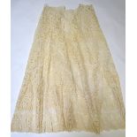 A full-length cream tape lace skirt and matching jacket (an extra pair of sleeves) and collar,
