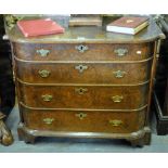 An early 18th century Dutch oak bow formed chest of four long graduated drawers raised on shaped