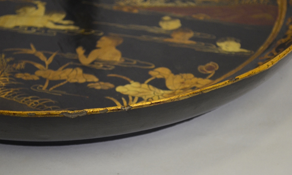 A Chinese black lacquer circular tray decorated in gilt with figures swimming amongst lotus in a - Image 2 of 5