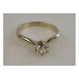 A single stone brilliant cut diamond ring in white metal high claw setting Condition