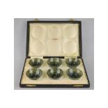 A set of six Chinese spinach jade small bowls, 6 cm diam, in fitted presentation box from H.