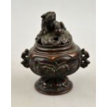 A Japanese bronze incense burner decorated in relief with panels of birds,