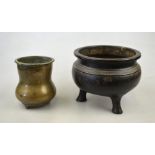 An 18th century Chinese bronze plain incense burner standing on three feet, 10 cm high,