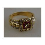 Ruby and diamond square cluster ring having two rows of diamonds on either side,