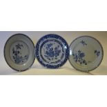 Three 18th century blue and white English Delft plates, all floral decorated in the Chinese style,