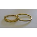 A yellow metal filigree style bracelet stamped 375 to/w a hinged bangle set with white synthetic