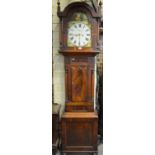 A Victorian mahogany eight-day longcase clock having a painted arched dial incorporating subsidiary
