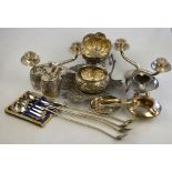 A quantity of Asian white metal, including embossed bowls, leaf serving dish, pair of candelabra,