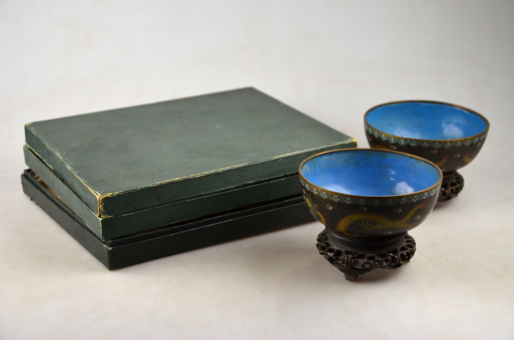 A pair of cloisonne bowls decorated with dragons contesting a flaming pearl, 11 cm dia. on stands