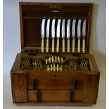 An Art Deco walnut canteen containing a set of electroplated OEP flatware for twelve,