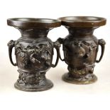 A pair of 19th century Chinese bronze vases cast with birds above dragons, 13.