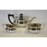 An epns three-piece tea service of oval compressed form with gadrooned rims