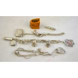 A silver fancy-link watch chain with dog-clip and T-bar,