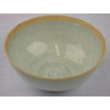 Chinese Song Dynasty - a small bowl glazed overall with a pale blue glaze, the interior centre