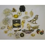 A collection of various brooches, mostly 1980s,