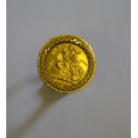 A 1976 sovereign in 9ct yellow gold cast ring setting,