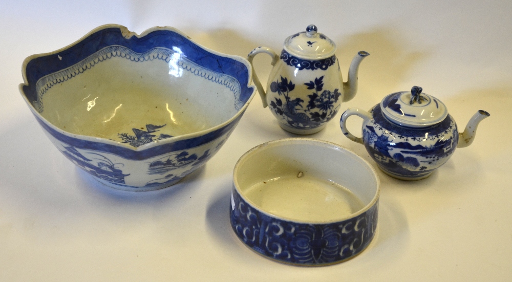 Two 19th century Chinese blue and white teapots, one decorated with pagodas in a watery landscape,