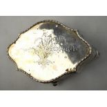 An Edwardian silver trinket box of shaped lozenge form with engraved hinged cover, London 1905,