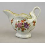 A Worcester first period porcelain cream jug modelled as a shell with moulded shell body and