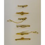 A collection of six yellow gold bar brooches,