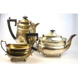 An oval silver teapot with gadrooned rim and ball feet, to/w a matching sugar basin, FTR & Co.