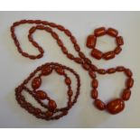 Two rows of red bakelite beads to/w seven red bakelite beads on elastic Condition Report Weight: